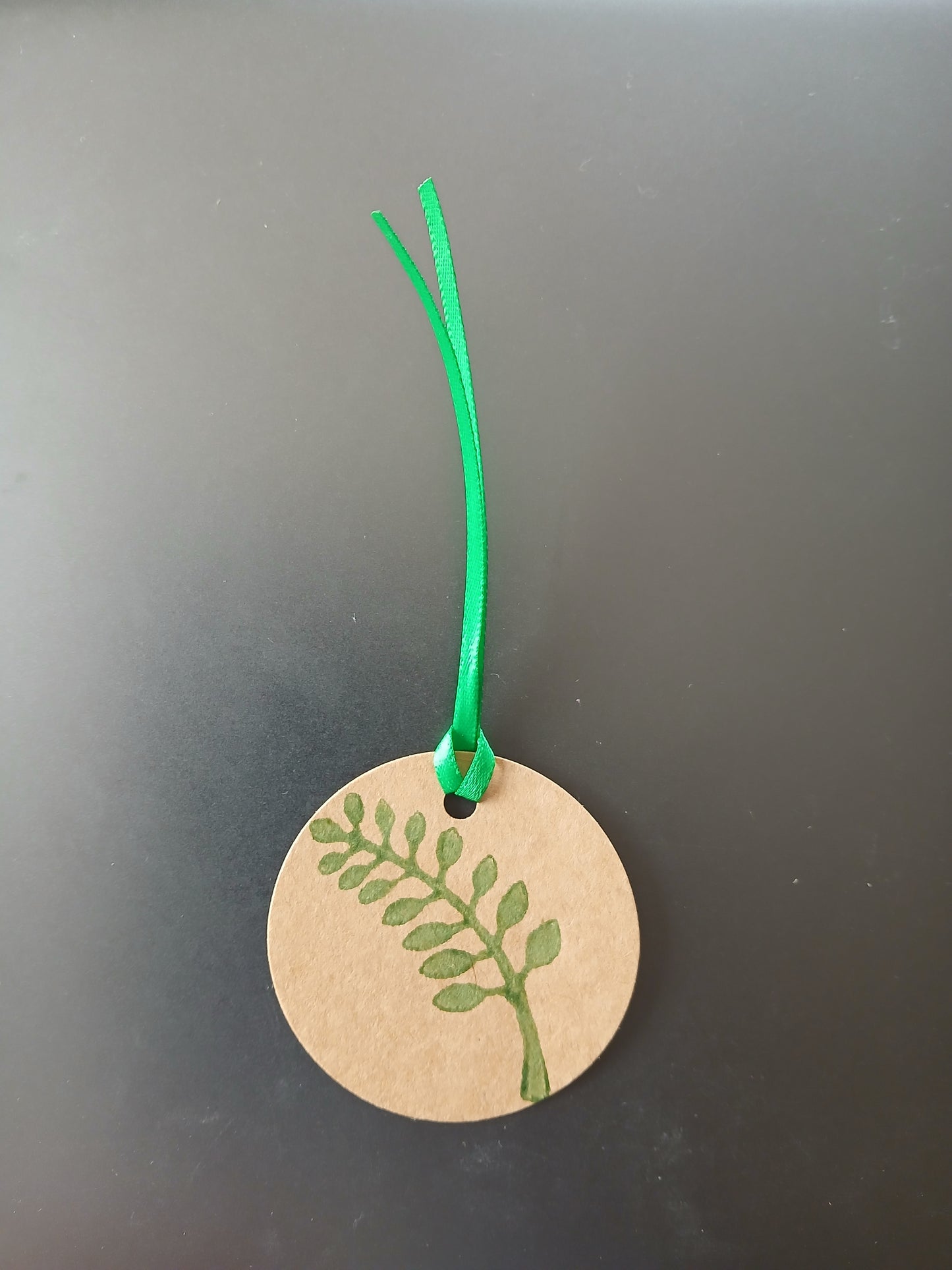 Indian Curved Leaf in Green on brown gift tag with ribbon