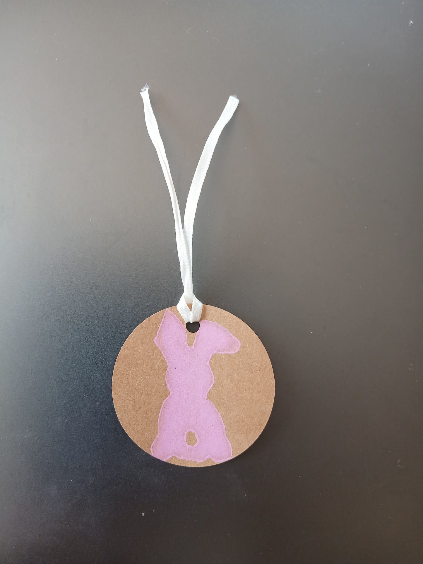 Bunny in Pink on round brown gift tag with ribbon