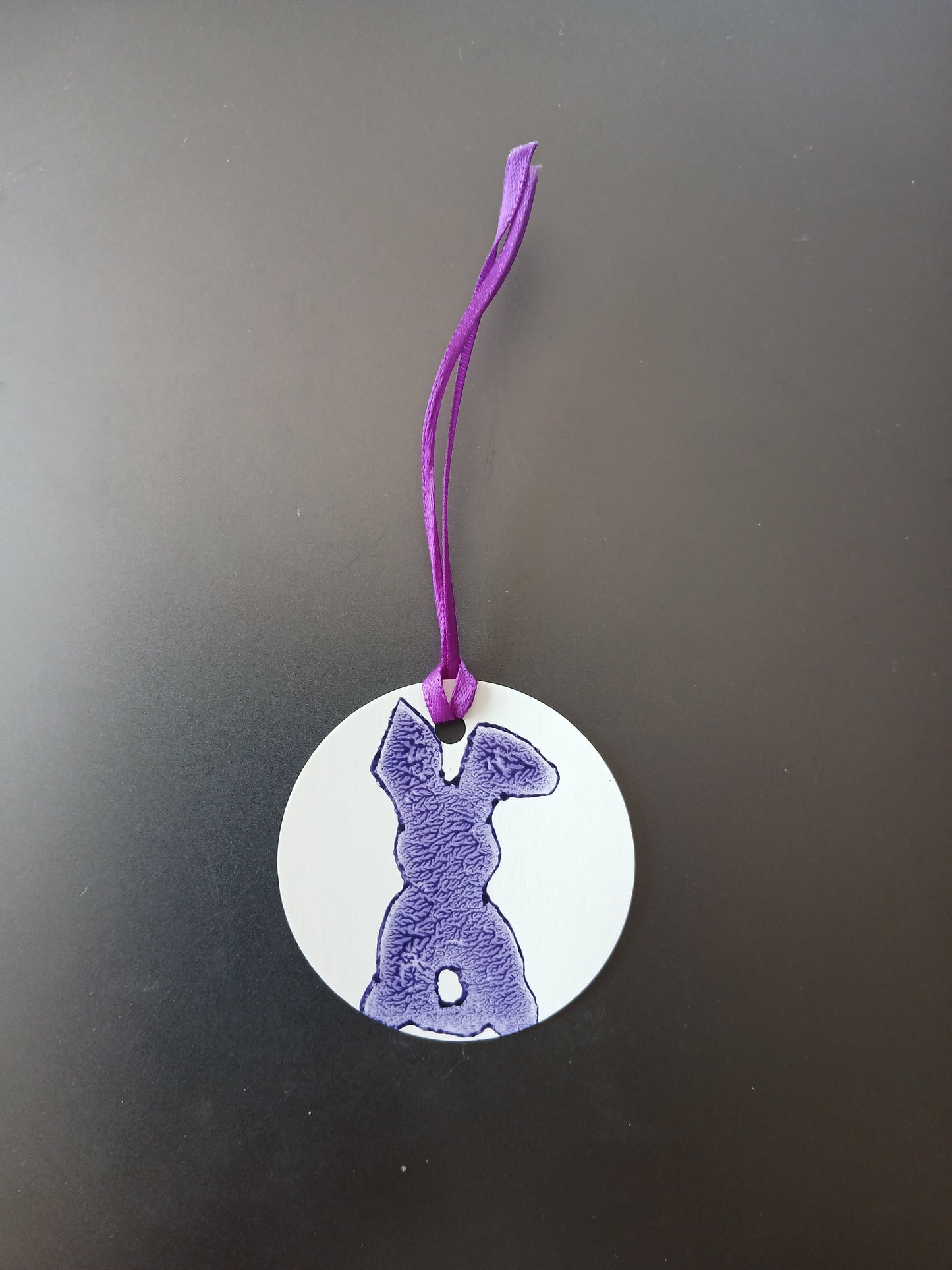 Bunny in Purple on round white gift tag with ribbon