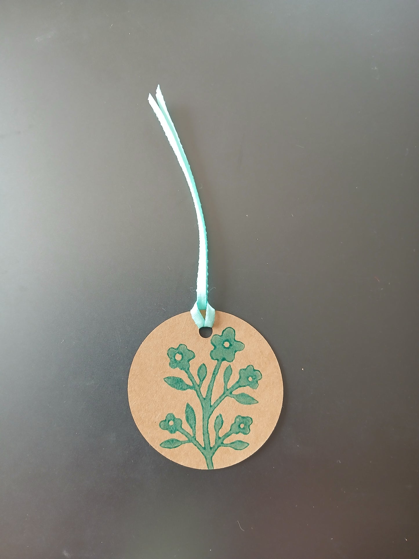 Flower Bunch in Teal on round brown gift tag with ribbon