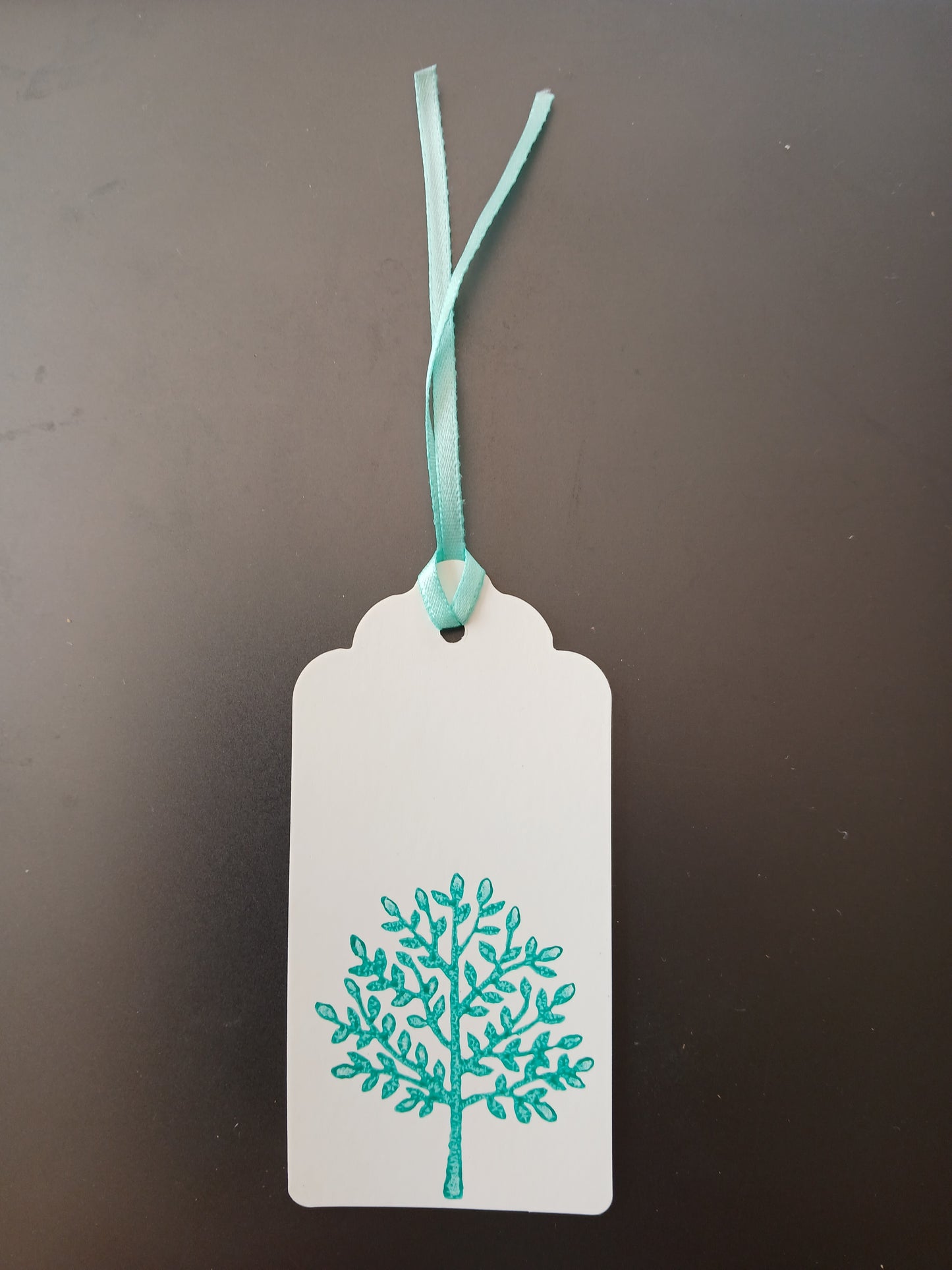 Indian Tree in Teal on oblong white gift tag with ribbon