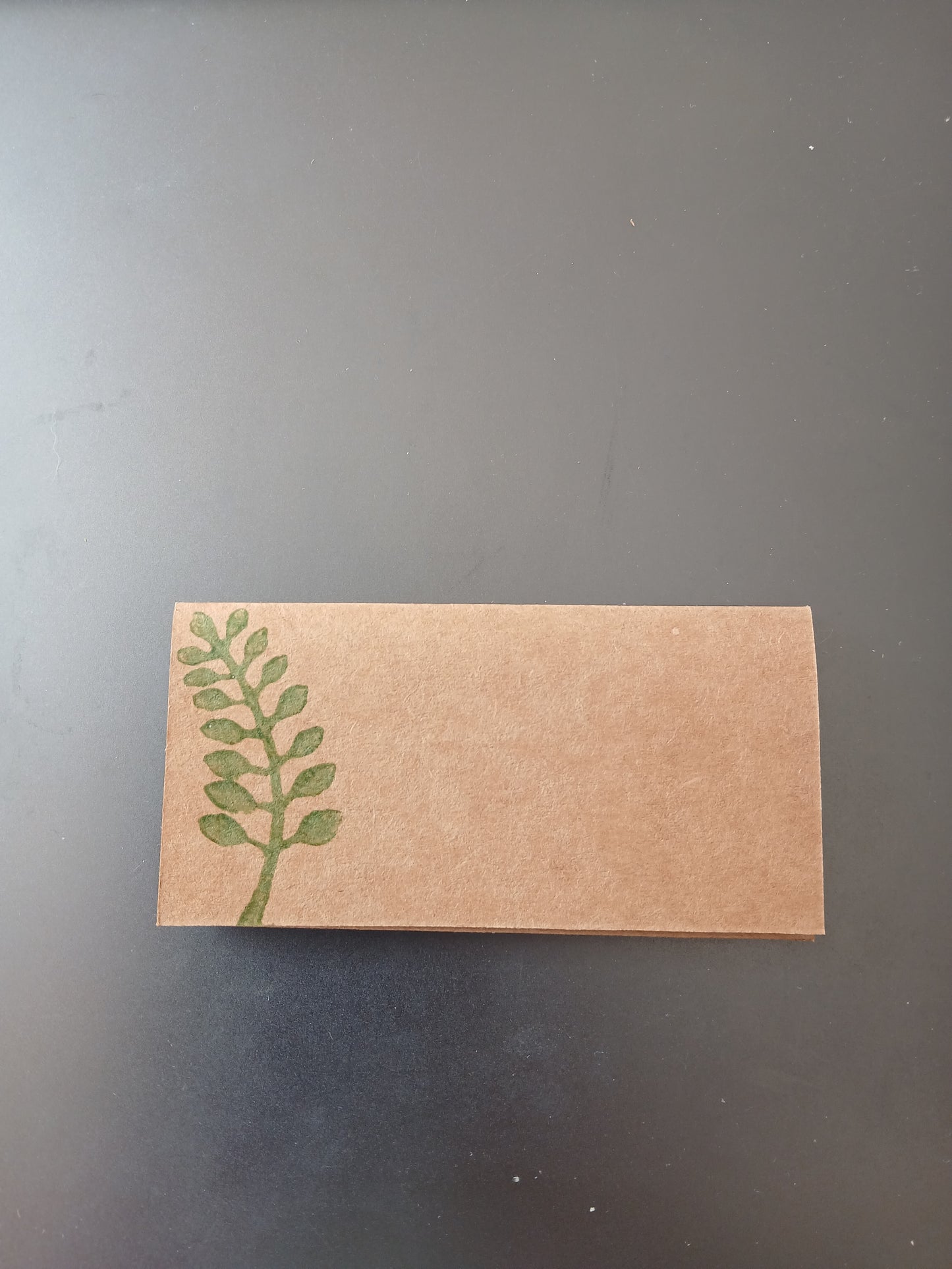 Indian Curved Leaf in Green on rectangle brown place card