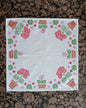 Geraniums in Red, Pink, Greens & Brown on white cotton napkin
