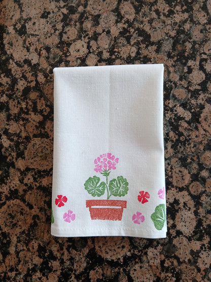 Geraniums in Red, Pink, Greens & Brown on white cotton napkin