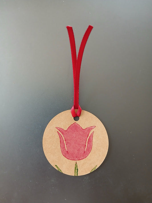 Tulip in Raspberry on round brown gift tag with ribbon
