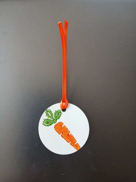 Carrot in Orange & Green on round white gift tag with ribbon