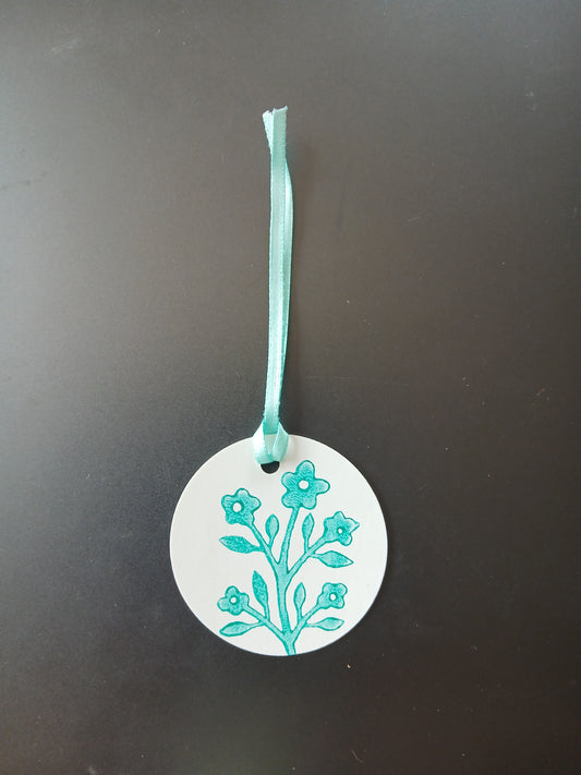 Flower Bunch in Teal on round white gift tag with ribbon
