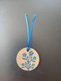 Flower Bunch in Brilliant Blue on round brown gift tag with ribbon