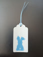 Bunny (small) in Blue on oblong white gift tag with ribbon
