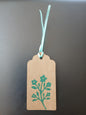 Flower Bunch in Teal on oblong brown gift tag with ribbon