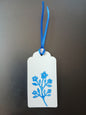 Flower Bunch in Brilliant Blue on oblong white gift tag with ribbon