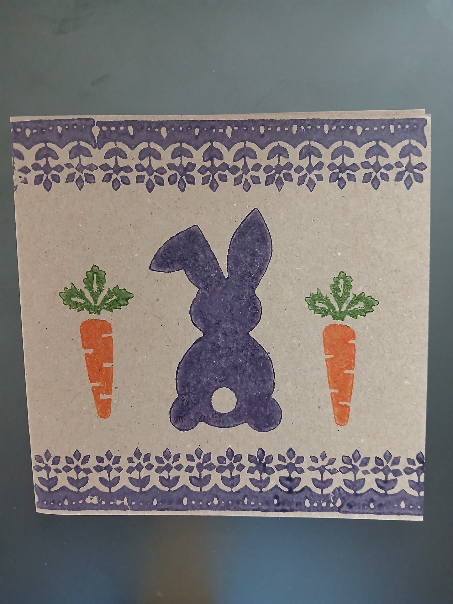 Bunny & Carrot with floral border in Purple, Orange & Green on brown card