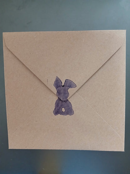 Bunny & Carrot with floral border in Purple, Orange & Green on brown card