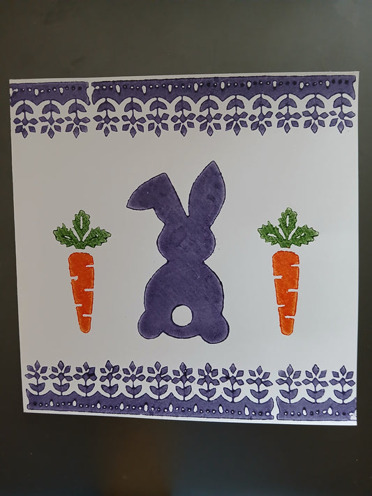 Bunny & Carrot with floral border in Purple, Orange & Green on white card