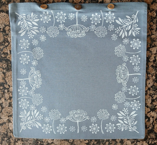 Seeds in White on dusky blue/grey cushion cover with buttons
