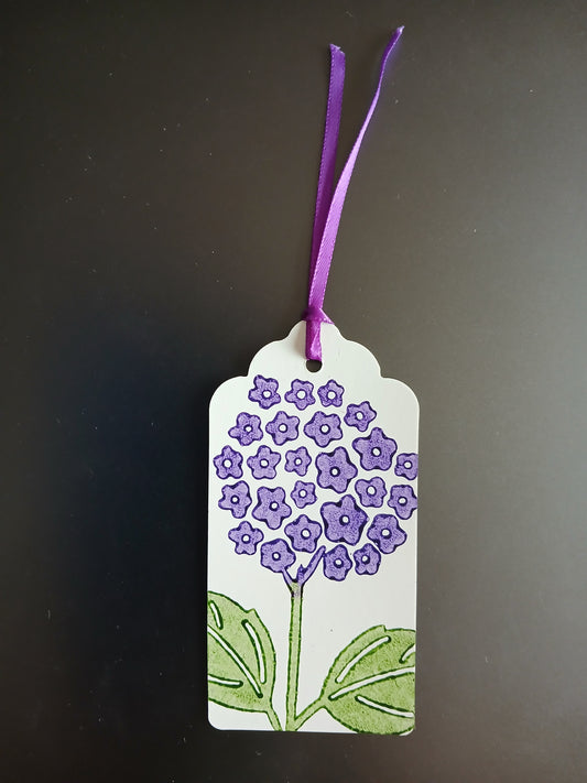 Hydrangea in Puple & Green on oblong brown gift tag with ribbon