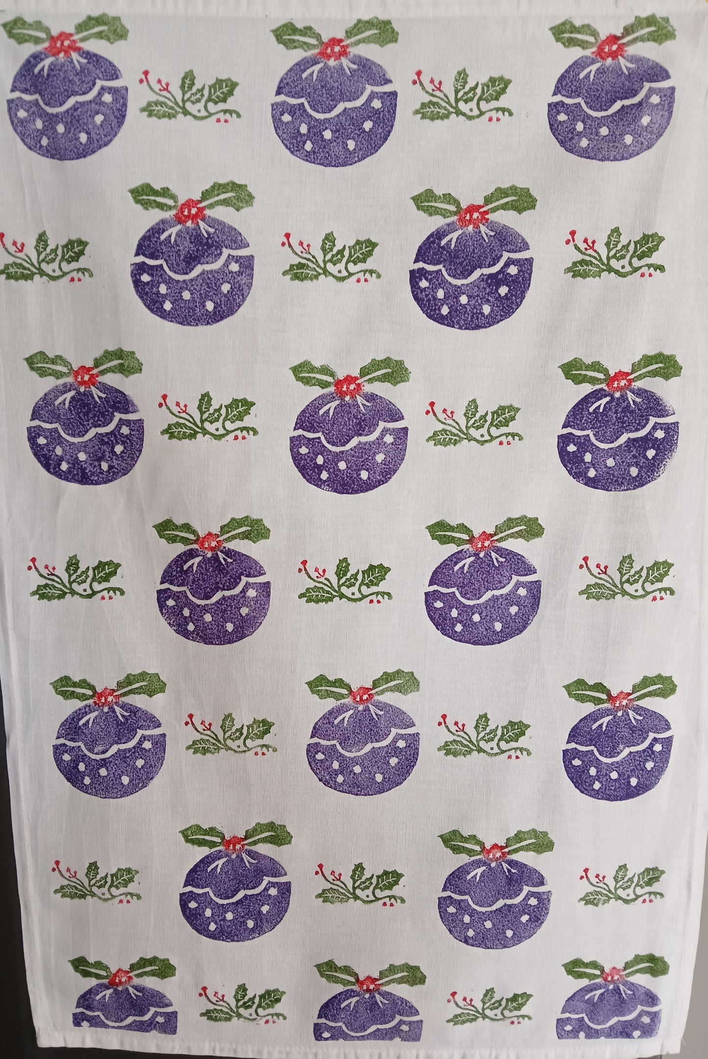 Christmas Pudding & Holly in Purple, Red & Green on cotton teatowel