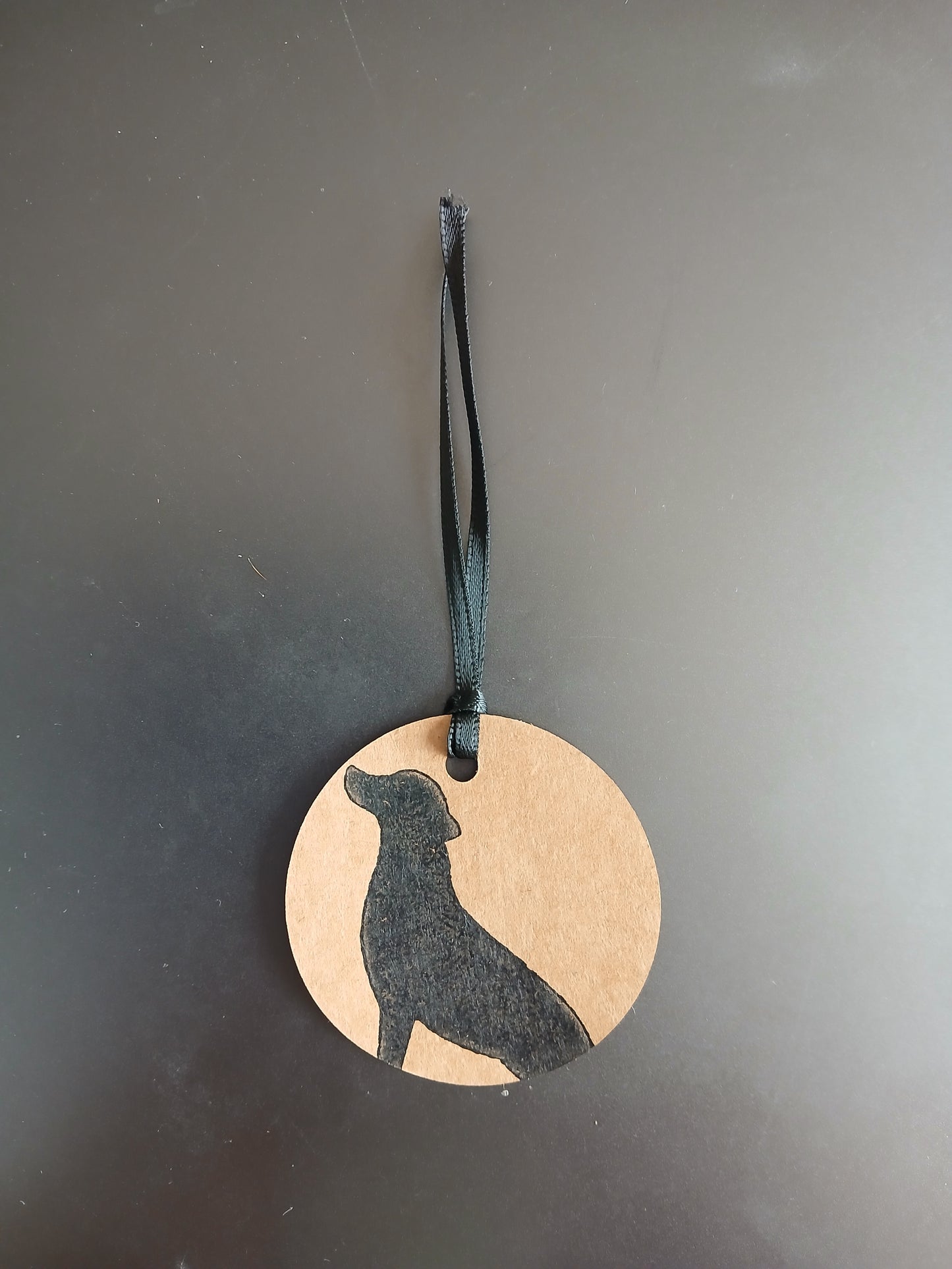 Labrador in Black on round brown gift tag with ribbon