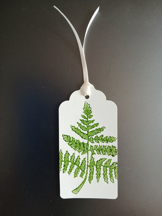 Fern 1 in Dark Green on oblong white gift tag with ribbon