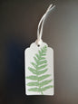 Fern 2 in Mid Green on oblong white gift tag with ribbon