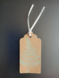 Fern 3 in Light Green on oblong brown gift tag with ribbon
