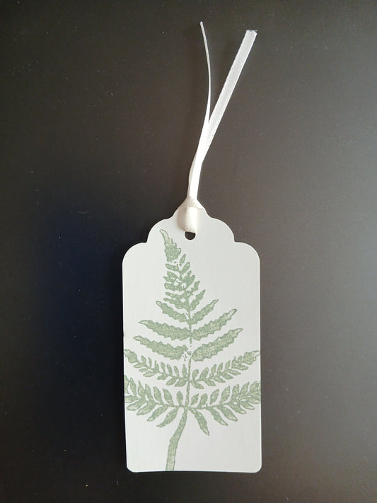 Fern 3 in Light Green on oblong white gift tag with ribbon