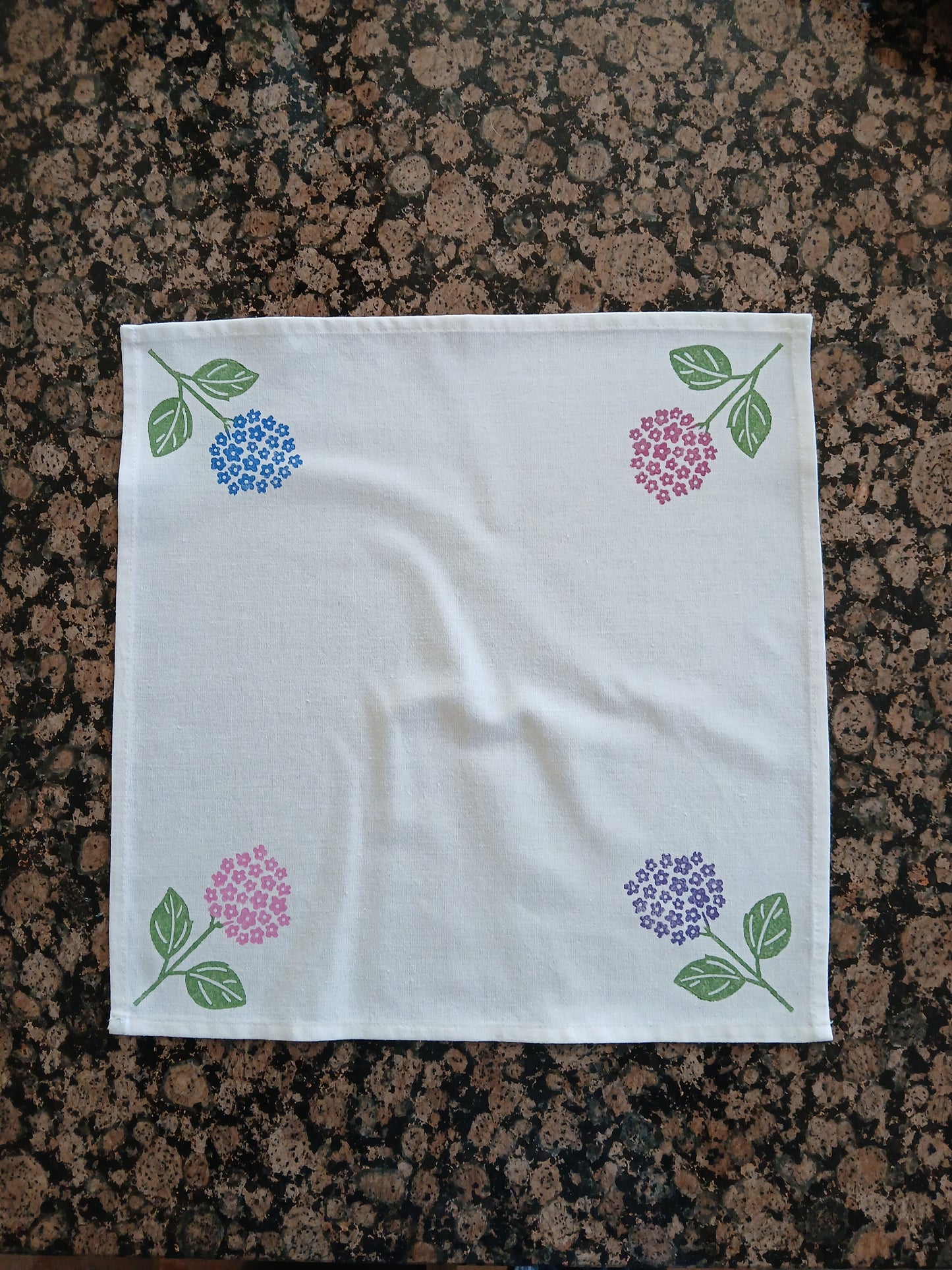 Hydrangeas on white cotton napkin