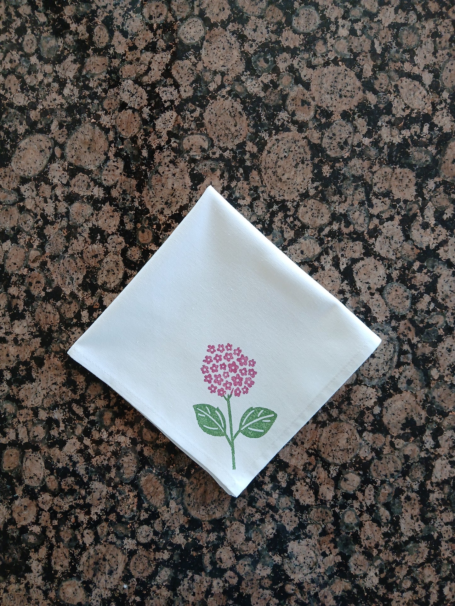 Hydrangeas on white cotton napkin