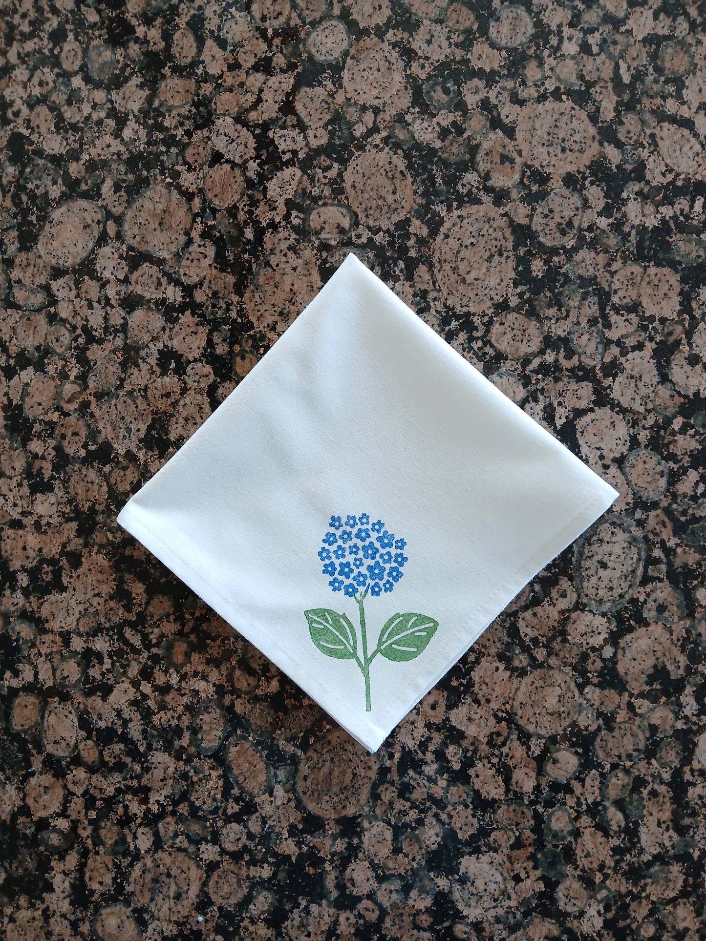 Hydrangeas on white cotton napkin