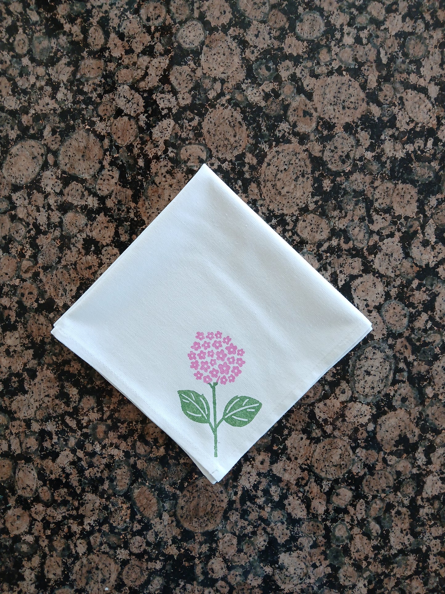 Hydrangeas on white cotton napkin