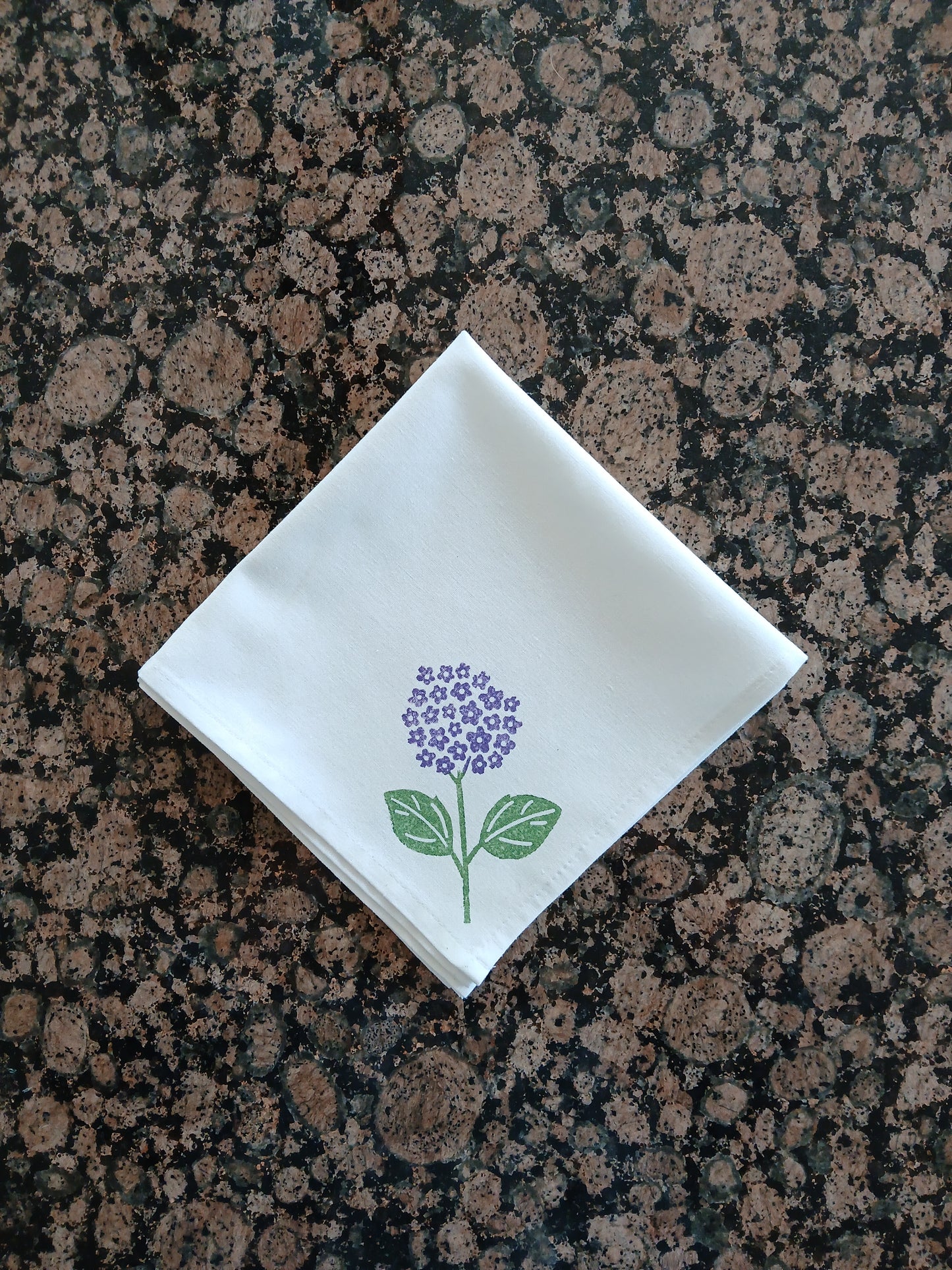 Hydrangeas on white cotton napkin
