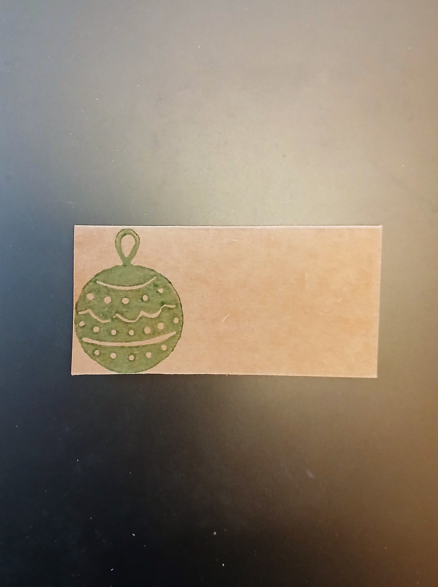 Christmas Bauble in green on rectangle brown place card