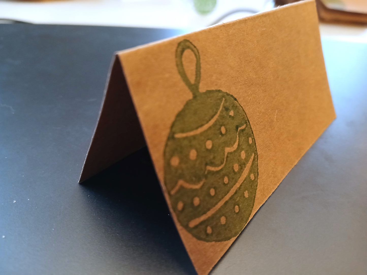 Christmas Bauble in green on rectangle brown place card