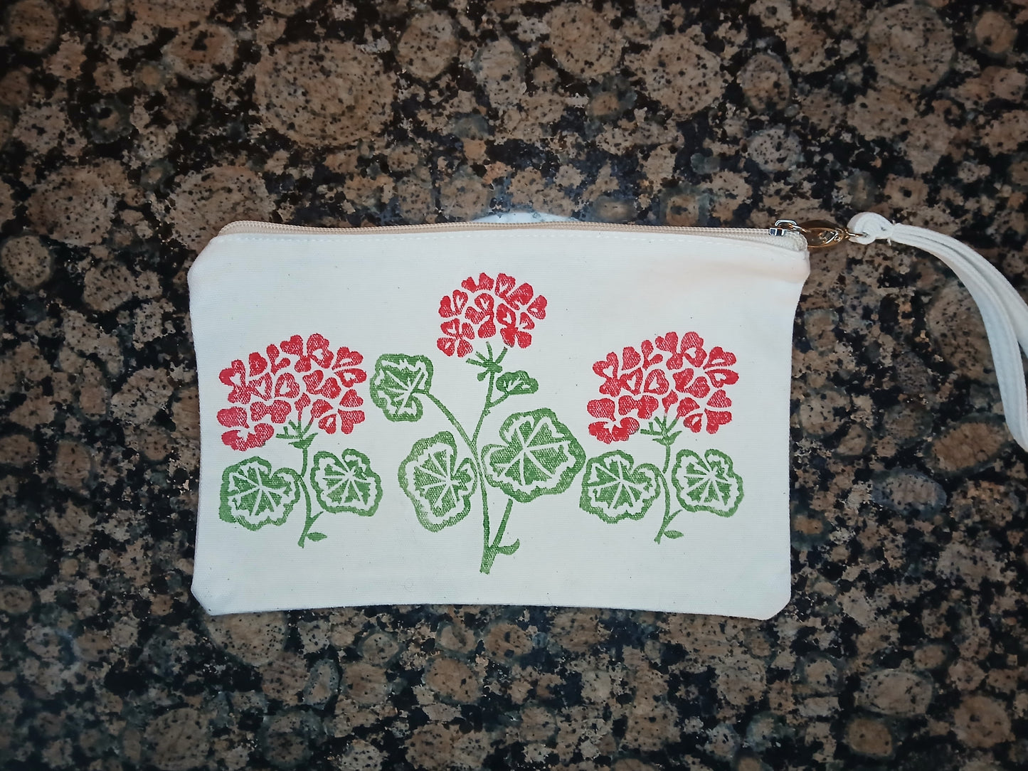 Geraniums in red & green on natural cotton canvas pouch