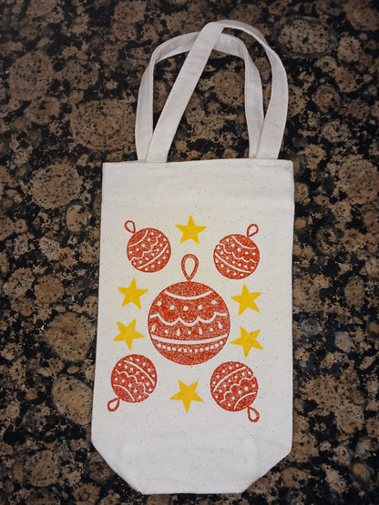 Christmas Baubles & Stars in red & yellow on natural cotton canvas bottle bag