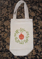 Wreath & Christmas Bauble in green & red on natural cotton canvas bottle bag