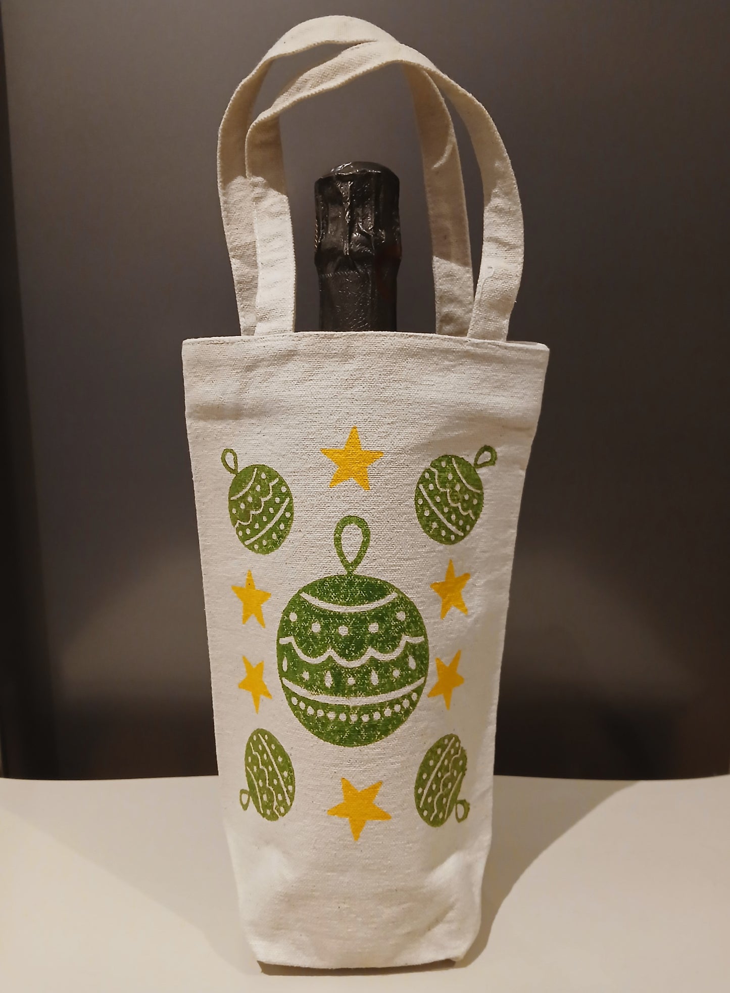 Christmas Baubles & Stars in green & yellow on natural cotton canvas bottle bag