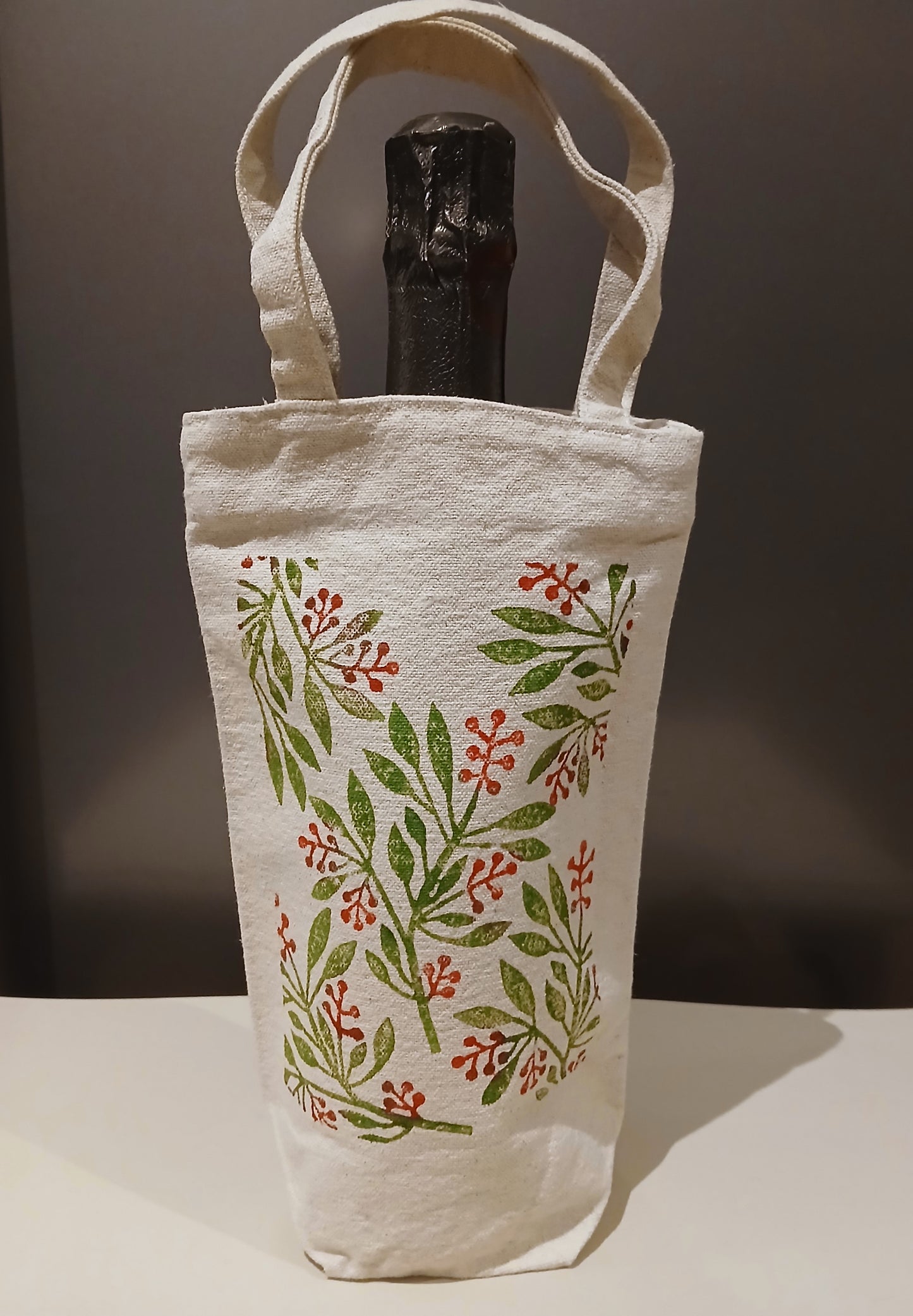 Leaves & Berries in green & red on natural cotton canvas bottle bag