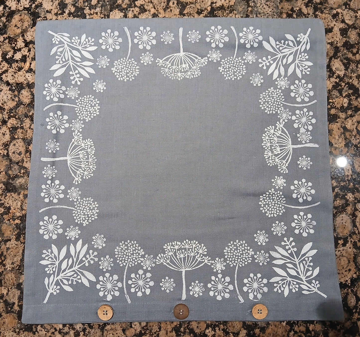Seeds in White on dusky blue/grey cushion cover with buttons