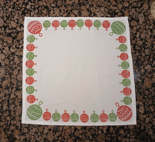 Christmas Baubles in red & green on white cotton napkin