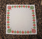 Christmas Baubles in red & green on white cotton napkin
