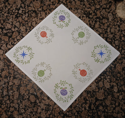 Christmas Wreaths on white cotton napkin