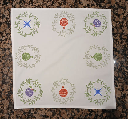 Christmas Wreaths on white cotton napkin