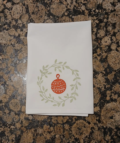 Christmas Wreaths on white cotton napkin