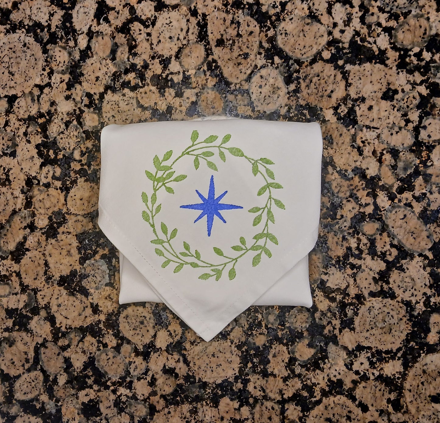 Christmas Wreaths on white cotton napkin