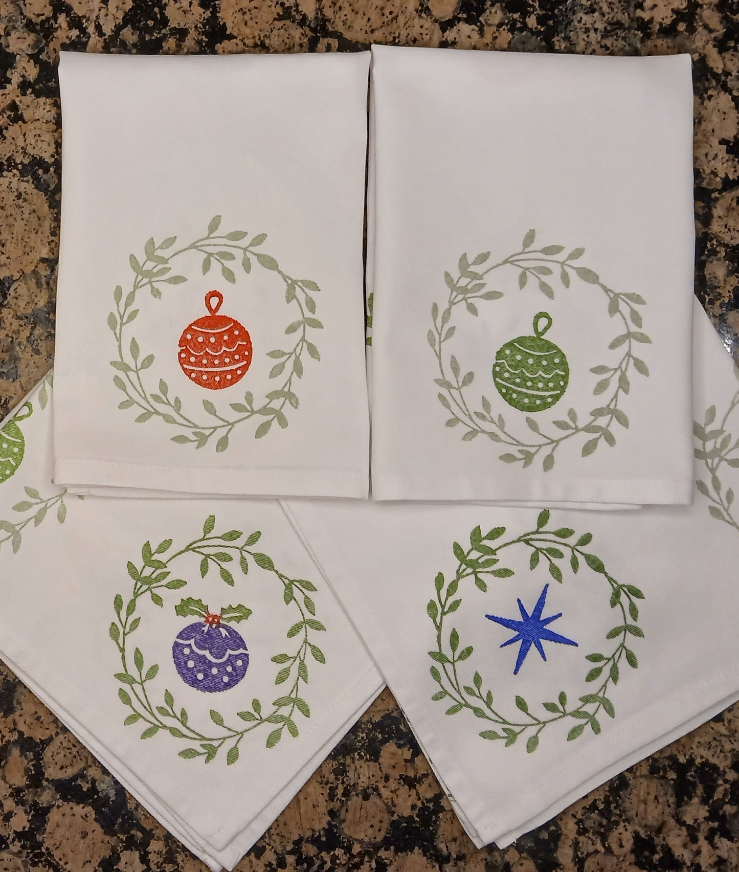 Christmas Wreaths on white cotton napkin