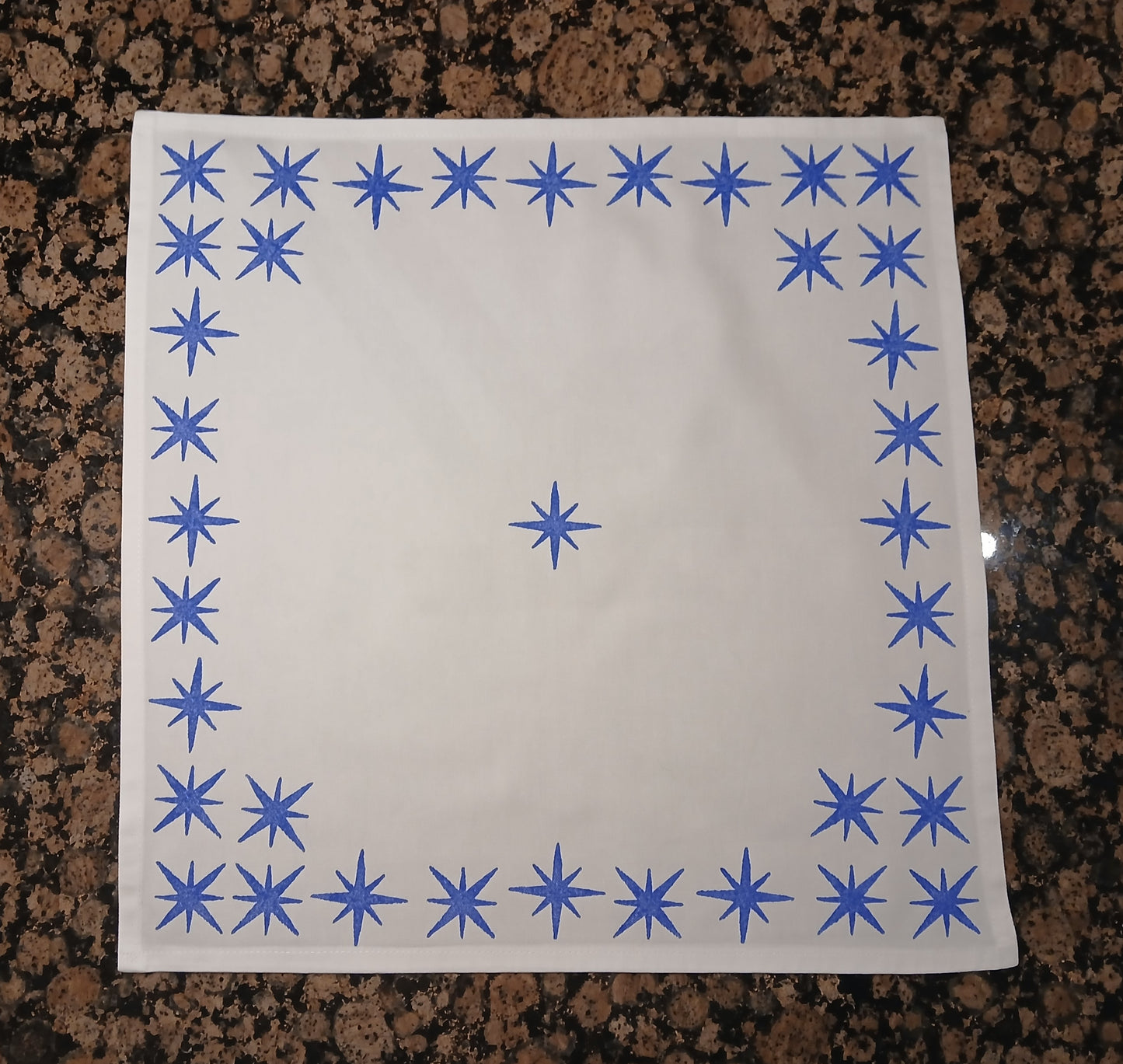 Stars in blue on white cotton napkin