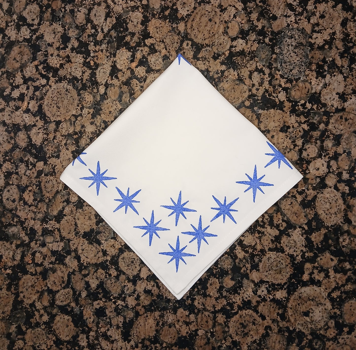 Stars in blue on white cotton napkin