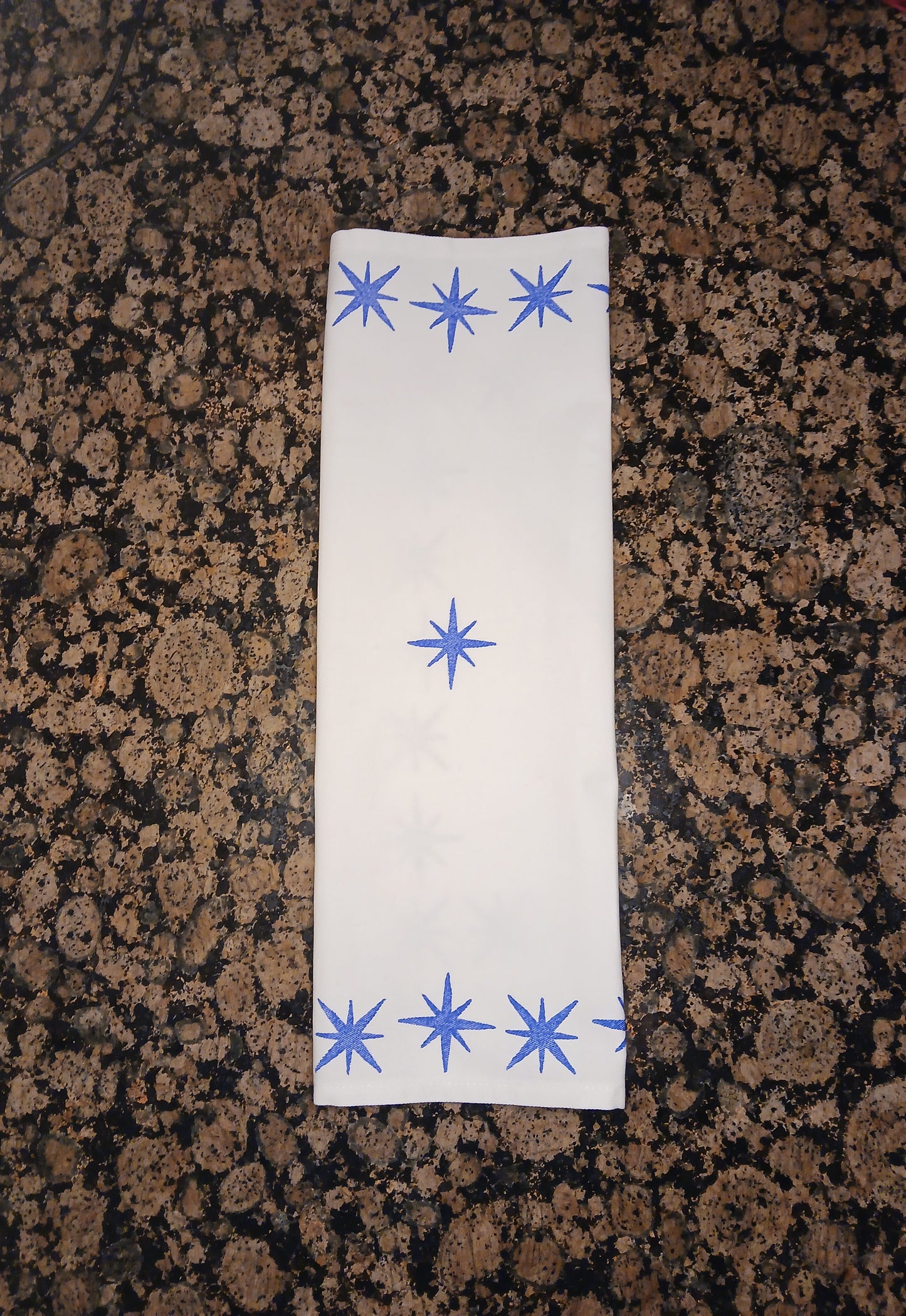 Stars in blue on white cotton napkin