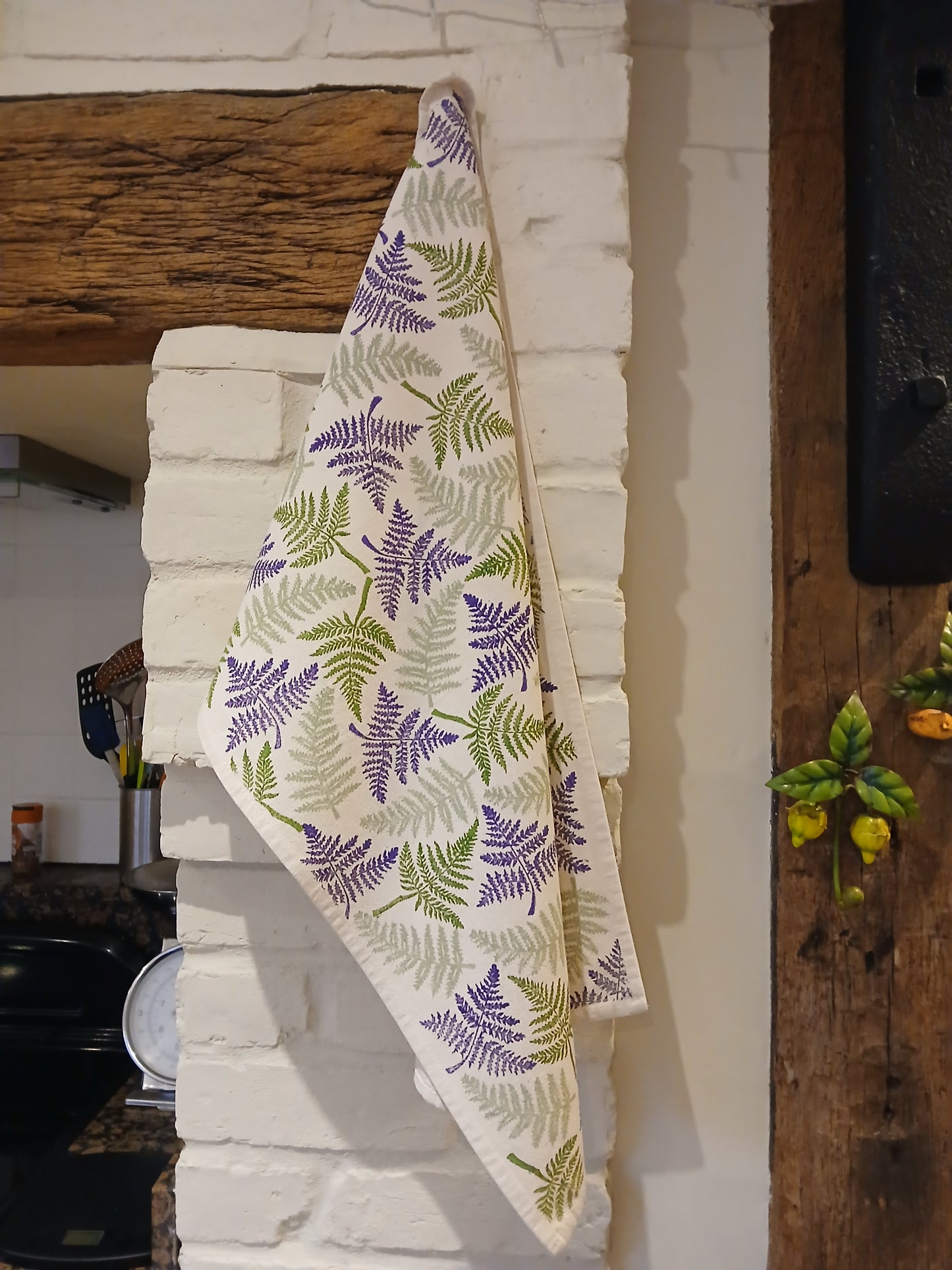 Ferns in two greens & purple on cotton teatowel